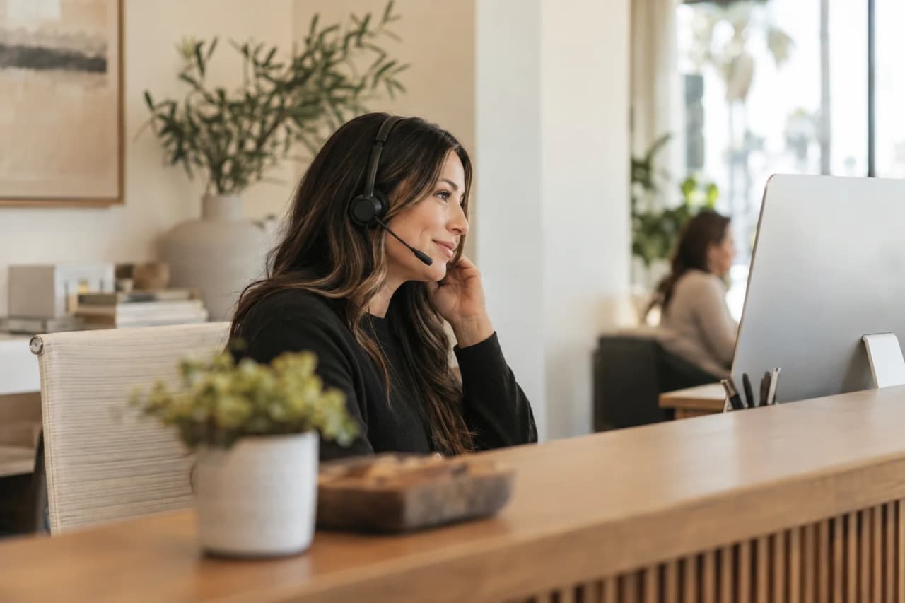 Admissions coordinator on a phone call scheduling an IOP assessment